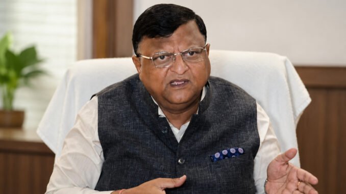 West Bengal’s new Chief Secretary Manoj Agarwal has signalled a major administrative reset at Nabanna, urging bureaucrats to work “with their spine straight” and warning against political interference in governance. In his first high-level meeting with departmental secretaries after taking charge, the 1990-batch IAS officer made it clear that the new administration expects officers to function strictly according to rules, professionalism and accountability. The strong message comes at a crucial political moment, with the newly formed BJP-led state government attempting to reshape Bengal’s administrative structure after the recent change in power. Addressing senior IAS officers on Tuesday, Agarwal stressed that honest governance does not require compromise. “Work fearlessly and with integrity. If you are doing your duty properly, there is no need to bend your spine,” he reportedly told officials during the meeting. Agarwal also instructed departments to immediately accelerate the implementation of Central government schemes that had allegedly remained stalled for years in the state. Alongside that, he directed officials to prepare roadmaps for implementing promises made in the BJP’s election manifesto, indicating that the administration wants quick delivery on governance commitments. The Chief Secretary’s remarks followed Chief Minister Suvendu Adhikari’s own tough administrative directives issued to district magistrates and police superintendents a day earlier. The Chief Minister reportedly ordered a “zero tolerance” policy against cattle smuggling, coal and sand trafficking, illegal syndicates and extortion networks operating in the state. Officials were also instructed to crack down on illegal encroachments of government land and immediately act against unauthorised construction activities. District administrations have further been asked to hold coordination meetings with newly elected MLAs and panchayat representatives to restart stalled development work across Bengal. Political observers see the developments as part of a broader effort by the new government to depoliticise the bureaucracy and restore administrative neutrality. According to analysts, the repeated emphasis on “professionalism,” “accountability” and “fearless governance” is being viewed as an indirect warning to officials accused of functioning under political pressure during the previous regime. Manoj Agarwal’s elevation to the post had been widely anticipated in bureaucratic circles. During the Assembly elections, he served as the Chief Electoral Officer (CEO) of West Bengal and was credited in many quarters for overseeing a comparatively smooth and transparent electoral process. There had been growing speculation within administrative circles that experienced officers such as Agarwal and retired IAS officer Subrata Gupta could return to key positions if the government changed. That prediction has now materialised. While Subrata Gupta was recently appointed adviser to the Chief Minister, Agarwal officially took over as the state’s Chief Secretary on Monday. The twin appointments are being seen as part of the government’s strategy to rebuild trust in the administrative system while projecting an image of stricter governance and institutional discipline.